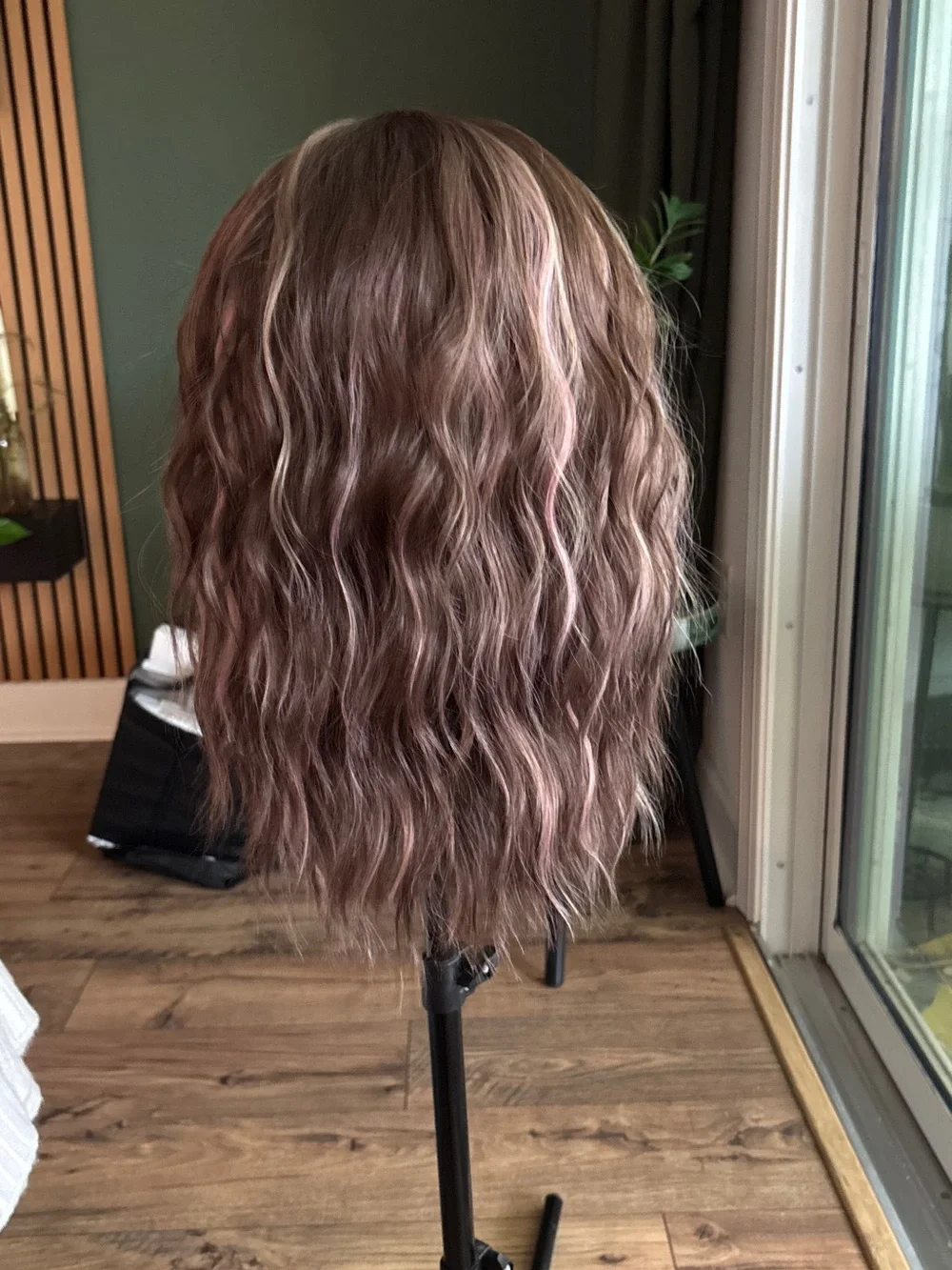 Carkira brown with pink face framing highlights. Petite but fits standard.